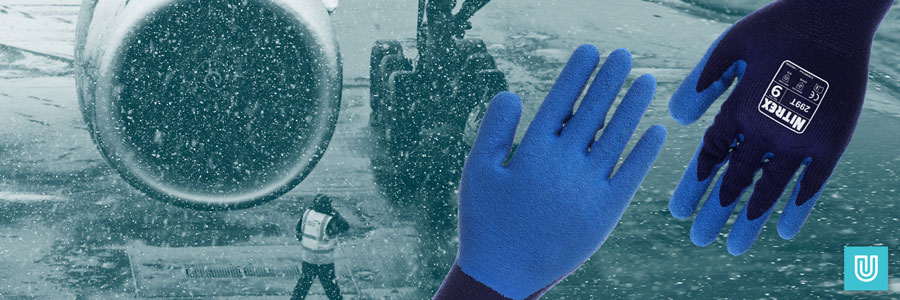 Nitrex 299T gloves by Unigloves being worn by an airport worker who is walking out on the runway ahead of a jumbo jet in the winter. It's snowing heavily and very cold.